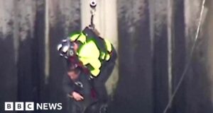 Watch: Man clings on for life in harrowing river rescue