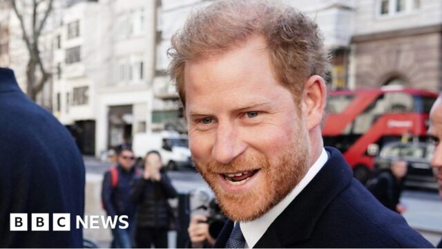 Prince Harry bumps into photographer outside court