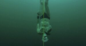 Free-diver plunges to record depth beneath frozen Swiss lake