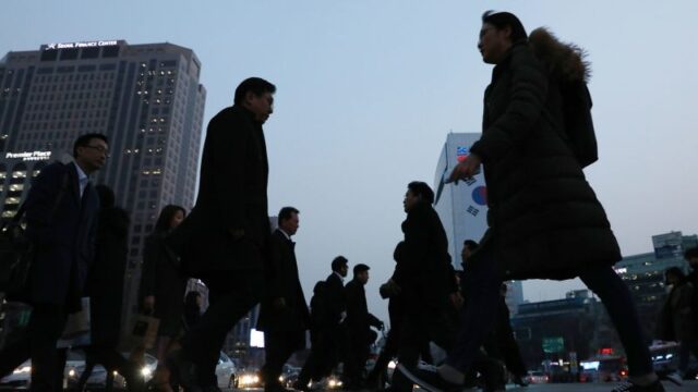 230317113749-seoul-pedestrians-file-022819.jpg