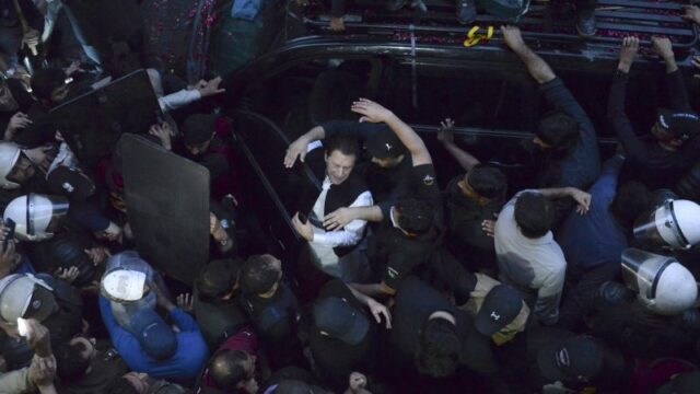 Imran Khan marks court presence as former Pakistan leader’s supporters clash with police