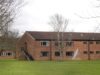 UK plan to house migrants in barracks and barges is condemned as ‘cruel’ and unworkable
