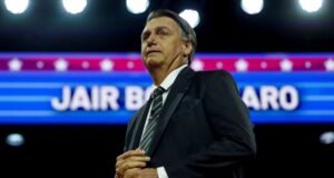 Bolsonaro greeted by small group of supporters on return to Brazil for first time since riots