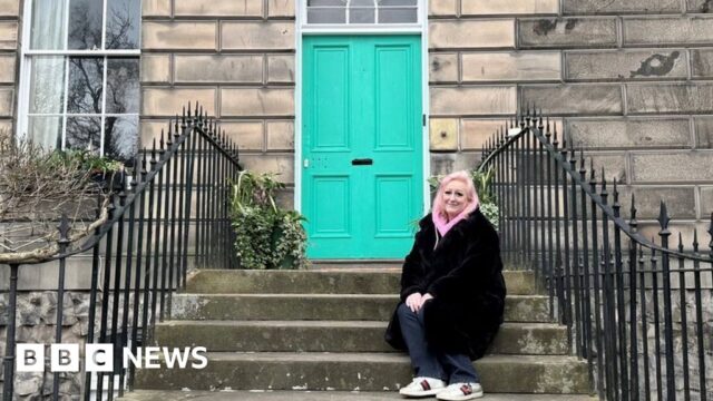 Edinburgh pink door woman sad after being forced to repaint