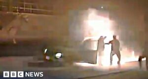 Watch police pull man, 84, from car overcome by flames