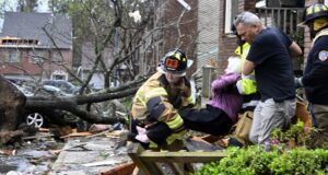 At least 22 killed and dozens hospitalized after violent storms and large tornadoes tore through the South and Midwest