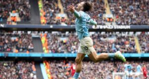 Manchester City thrashes Liverpool to keep in touch with Arsenal at top of English Premier League