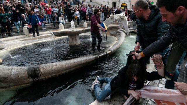 230401115430-01-climate-activists-spanish-steps-0401.jpg