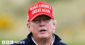 Donald Trump greeted by hat-waving staff at Turnberry golf resort