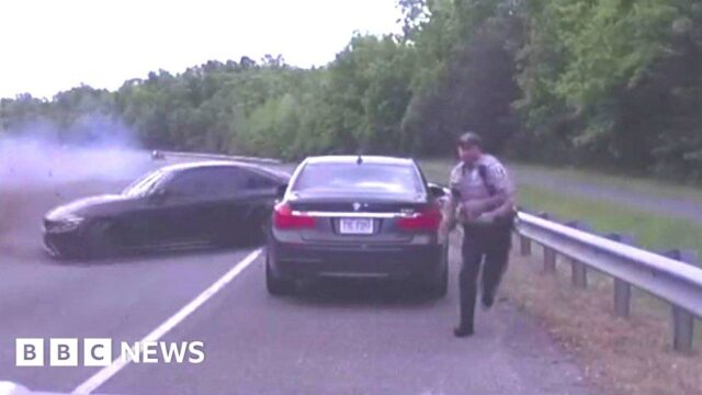 Officer inches from death as car spins across highway